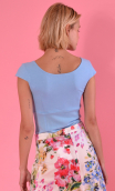 Top Nijinski light bleu, Glamorous, fitted, with plunging neckline, embellished with a drape crossed in front, very sixties.